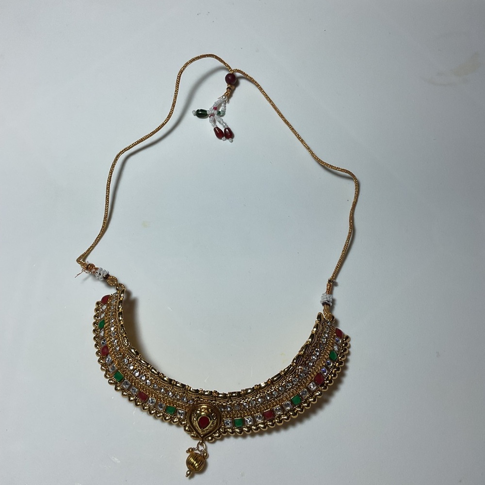 Gold and Red Crescent Necklace with Intricate Details